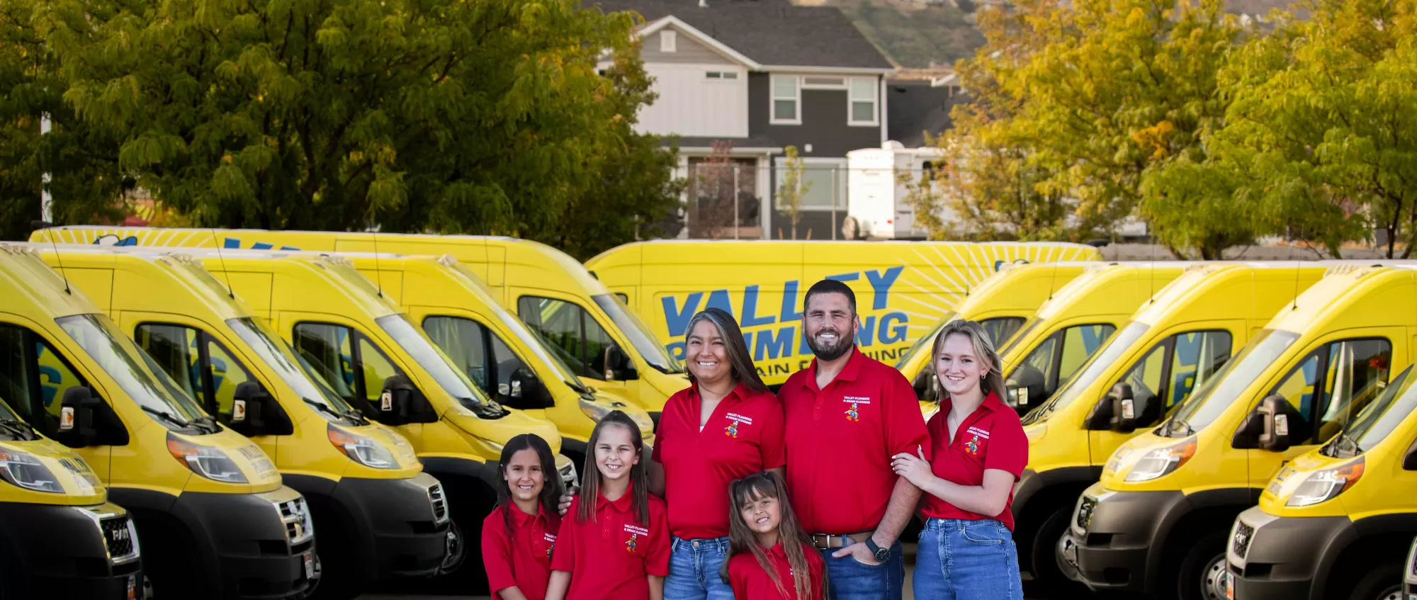 Two Valley Plumbing technicians in front of a service truck